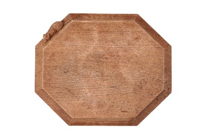 Lot 138 - A Robert ‘Mouseman’ Thompson, Kilburn, carved octagonal oak breadboard