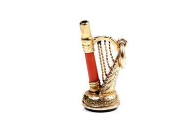Lot 44 - A 19th Century coral novelty watch key modelled as a harp