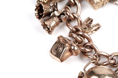 Lot 109 - A 9ct gold curb-link charm bracelet