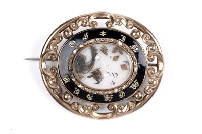Lot 72 - A Victorian enamelled mourning brooch