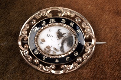 Lot 146 - A Victorian enamelled mourning brooch