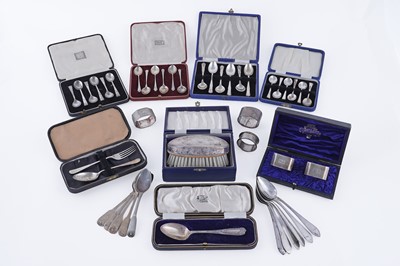 Lot 323 - A collection of silver spoons and napkin rings