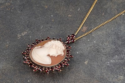 Lot 63 - A garnet and carved cameo pendant brooch