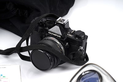 Lot 130 - An Olympus OM-1 N camera; and a Lomo Lubitel 2 TLR camera