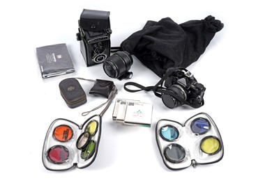 Lot 130 - An Olympus OM-1 N camera; and a Lomo Lubitel 2 TLR camera