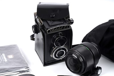 Lot 130 - An Olympus OM-1 N camera; and a Lomo Lubitel 2 TLR camera