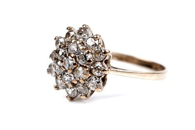 Lot 65 - A cubic zirconia flowerhead pattern cluster ring