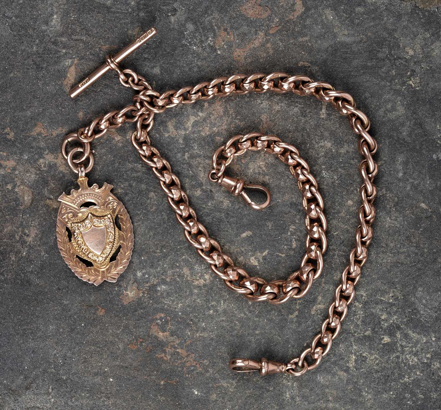Lot 45 - An early 20th Century 9ct rose gold double "Albert" watch chain; and a fob medallion