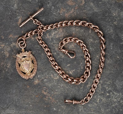 Lot 45 - An early 20th Century 9ct rose gold double "Albert" watch chain; and a fob medallion