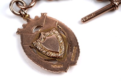 Lot 45 - An early 20th Century 9ct rose gold double "Albert" watch chain; and a fob medallion