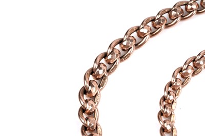 Lot 45 - An early 20th Century 9ct rose gold double "Albert" watch chain; and a fob medallion