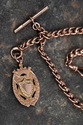 Lot 45 - An early 20th Century 9ct rose gold double "Albert" watch chain; and a fob medallion