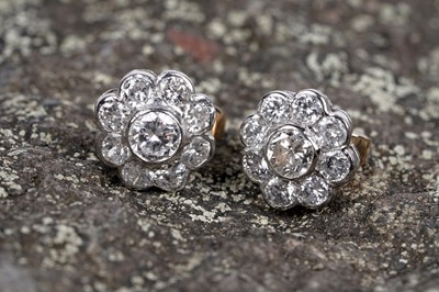Lot 3 - A pair of diamond flowerhead pattern stud earrings