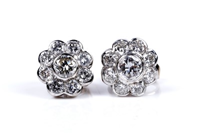 Lot 3 - A pair of diamond flowerhead pattern stud earrings