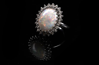 Lot 561 - An opal and diamond cluster ring