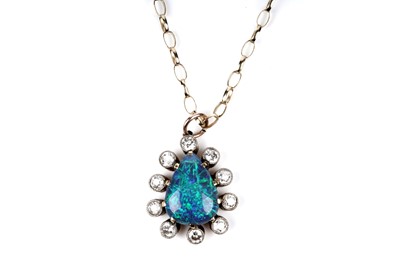 Lot 552 - A black opal and diamond pendant