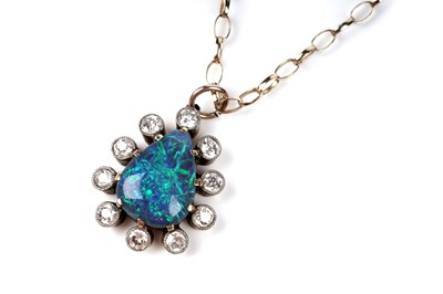 Lot 552 - A black opal and diamond pendant