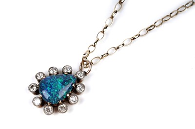 Lot 552 - A black opal and diamond pendant