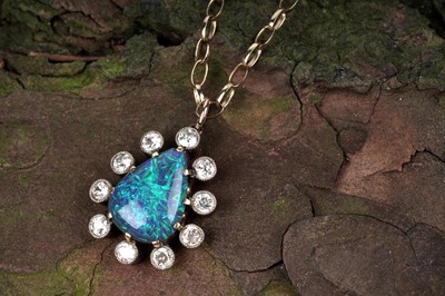 Lot 552 - A black opal and diamond pendant