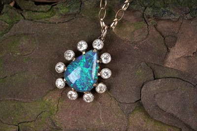 Lot 552 - A black opal and diamond pendant