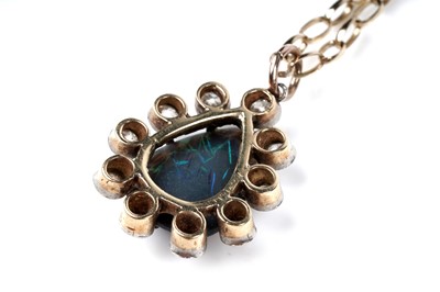 Lot 552 - A black opal and diamond pendant