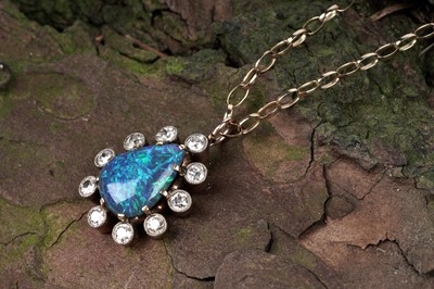 Lot 552 - A black opal and diamond pendant
