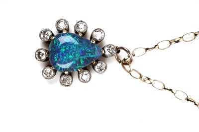 Lot 552 - A black opal and diamond pendant