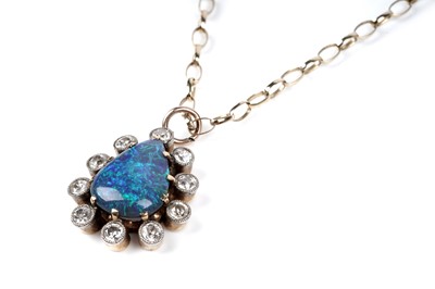 Lot 552 - A black opal and diamond pendant