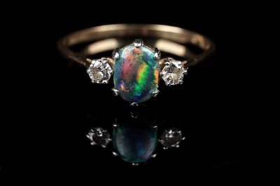 Lot 554 - A black opal and diamond ring