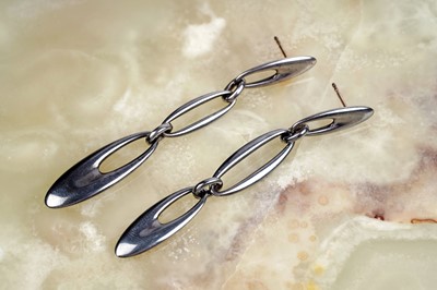 Lot 163 - A pair of Georg Jensen silver "Zephyr" pattern pendant earrings