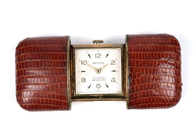 Lot 458 - Hermes: a gilt metal and leather covered purse watch