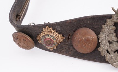 Lot 22 - A WWI plaque; and cap badge mounted belt