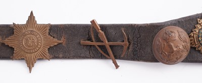 Lot 22 - A WWI plaque; and cap badge mounted belt