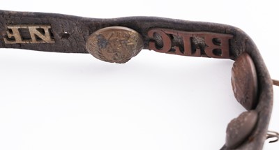 Lot 22 - A WWI plaque; and cap badge mounted belt
