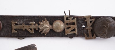 Lot 22 - A WWI plaque; and cap badge mounted belt