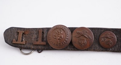 Lot 22 - A WWI plaque; and cap badge mounted belt