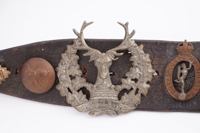 Lot 22 - A WWI plaque; and cap badge mounted belt