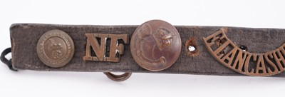 Lot 22 - A WWI plaque; and cap badge mounted belt