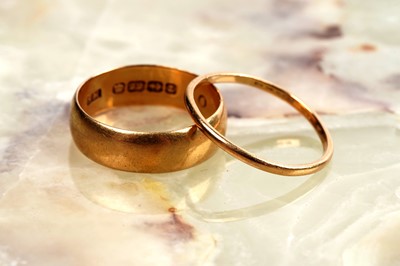 Lot 30 - Two 22ct gold wedding bands