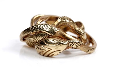 Lot 122 - A Chaumet 18ct gold serpent pattern puzzle ring
