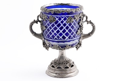 Lot 299 - A silverplate two handled urn with blue cutglass liner