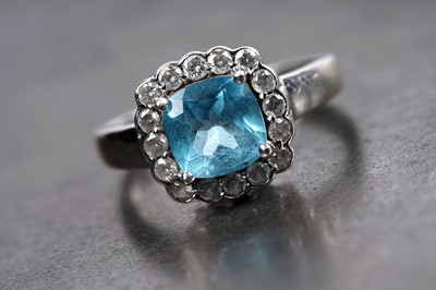 Lot 86 - A "Swiss blue" topaz and diamond ring