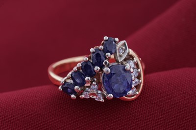 Lot 83 - A modern sapphire and diamond cocktail ring