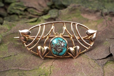 Lot 558 - Murrle Bennett & Co: an Edwardian Arts and Crafts turquoise and 9ct yellow gold brooch