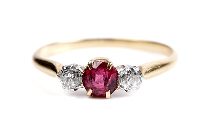 Lot 141 - A ruby and diamond three-stone ring