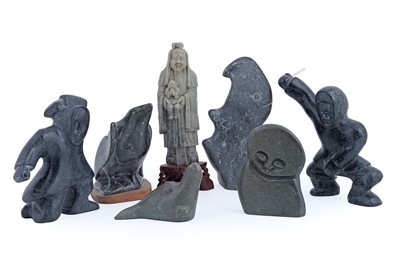 Lot 219 - A collection of Inuit soapstone carvings; and an Oriental jadeite figure