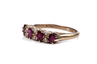 Lot 143 - A ruby and diamond bow pattern ring
