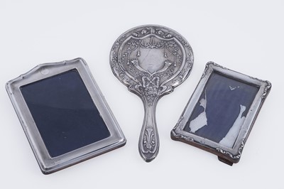 Lot 406 - Two silver photograph frames; and a George V silver mirror