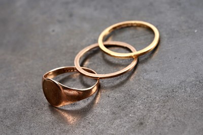 Lot 176 - Three gold rings including: a 22ct gold wedding band