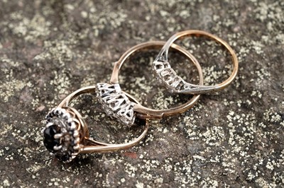 Lot 186 - Three rings including: an early 20th Century three-stone diamond ring